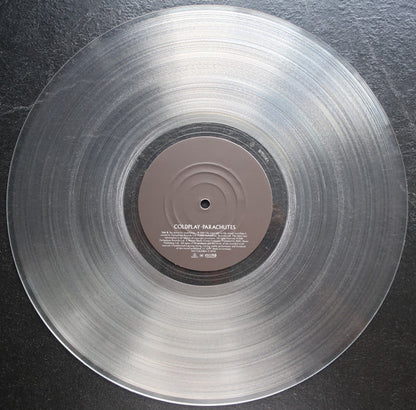 Coldplay ‎– Parachutes - LP - Clear - 140gr. - 2025 - Parlophone ‎– 5021732630865 - NUEVO - PRECINTADO / NEW – SEALED.